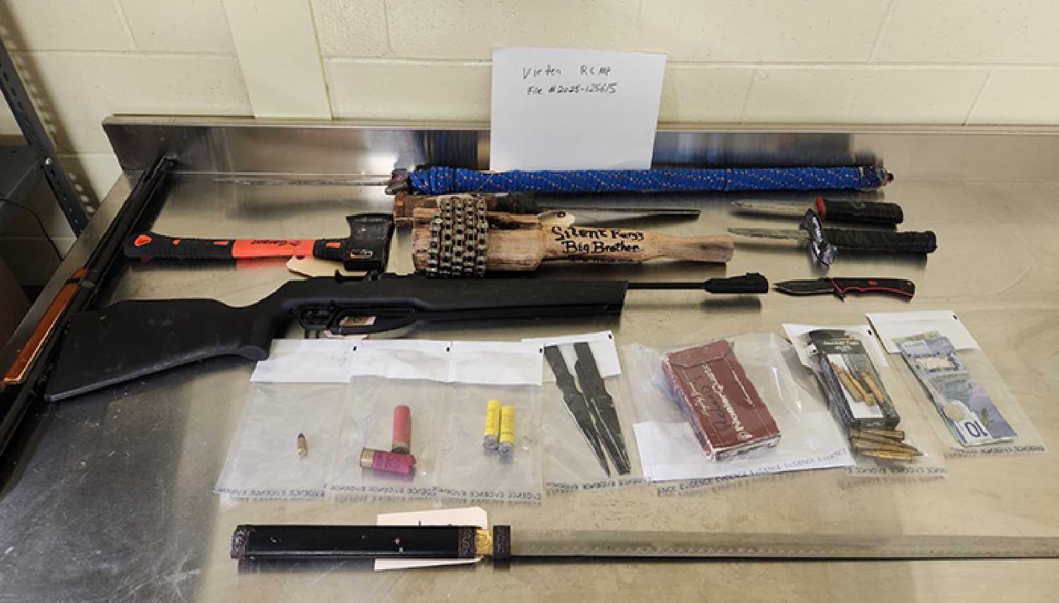 Weapons and baggies of suspected drugs and drug related paraphernalia